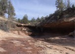 Dripping Springs -- The space under the rock ledge is large enough to provide shelter for about ten people. Lamont Crabtree Photo